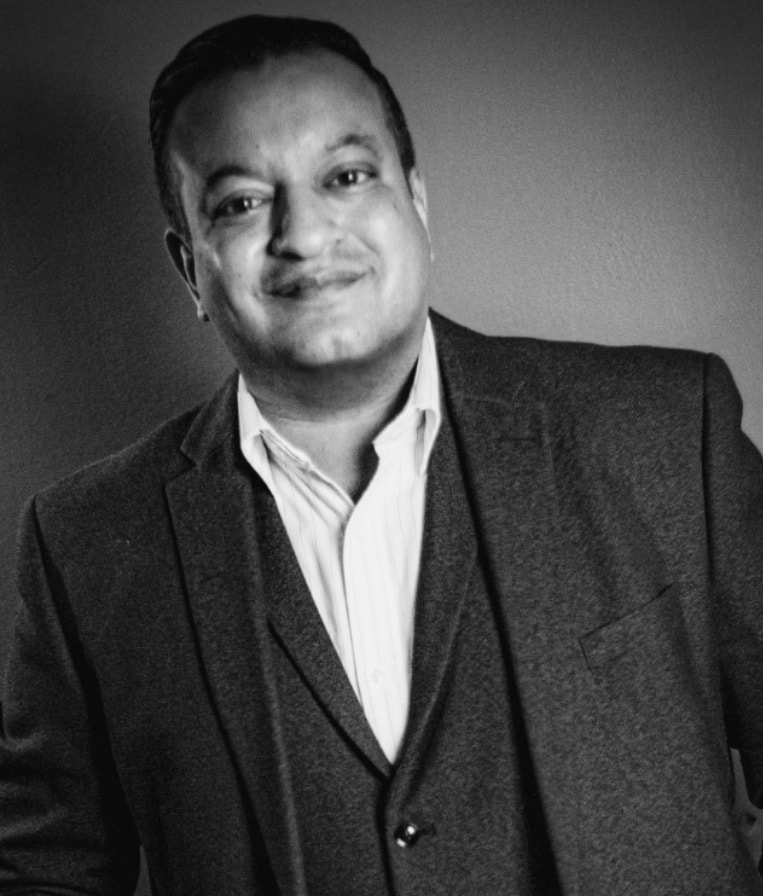Portrait of Majid Lavji in a three-piece suit